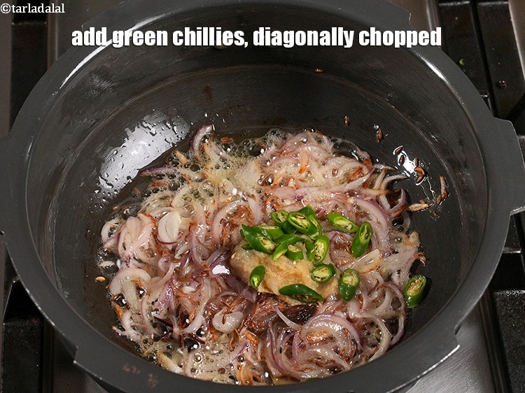 Step 33 – <p>Add 1 tbsp <a href="https://www.tarladalal.com/glossary-chopped-green-chilli-820i">chopped green chillies</a>, diagonally chopped.</p>