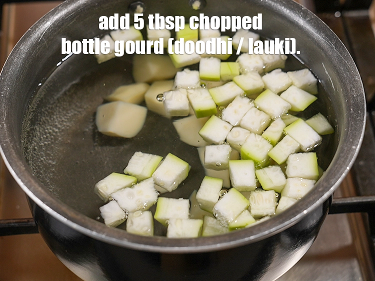 Step 23 – <p>Add 5 tbsp&nbsp;<a href="https://www.tarladalal.com/glossary-chopped-bottle-gourd-401i">chopped bottle gourd (doodhi / lauki)</a>.&nbsp;</p>