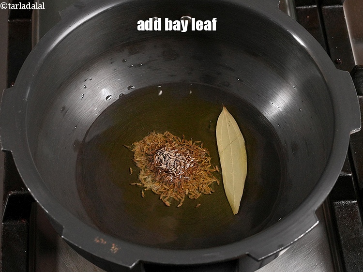 Step 25 – <p>Add 1 <a href="https://www.tarladalal.com/glossary-bay-leaf-tejpatta-bay-leaves-189i">bay leaf (tejpatta)</a>.</p>