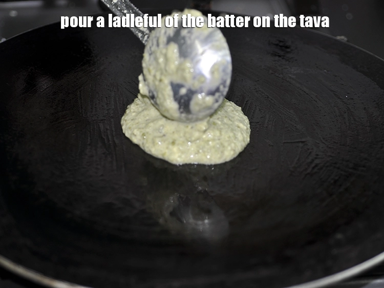 Step 23 – <p>Pour a ladleful of the batter on the tava .</p>