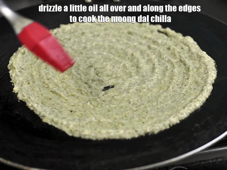 Step 25 – <p>Drizzle a little oil all over and along the edges to cook the moong dal …