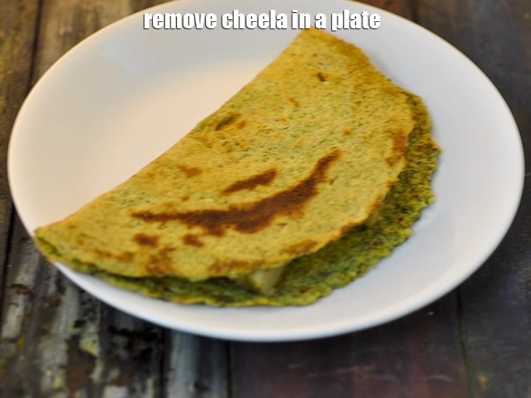Step 29 – <p>Remove our <strong>aloo-matar moong dal cheela</strong> in a plate.</p>