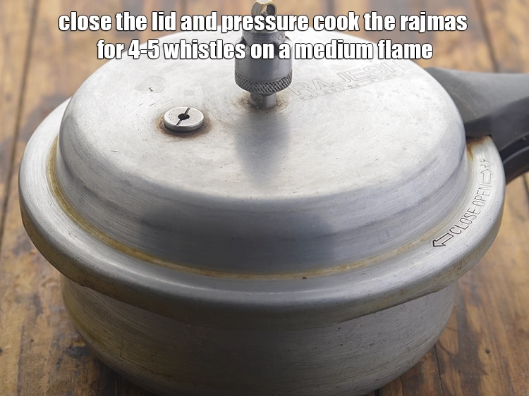 Step 11 – <p>Close the lid and pressure cook the rajmas for 4-5 whistles&nbsp;on a medium flame.</p>