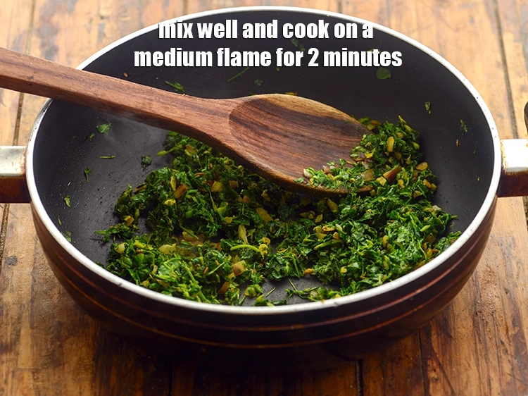 Step 32 – <p><span style="background-color:rgb(255,255,255);color:rgb(0,0,0);">Mix well and cook on a medium flame for 2 minutes, while stirring occasionally.</span></p>