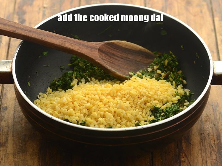 Step 44 – <p><span style="background-color:rgb(255,255,255);color:rgb(0,0,0);">Add the cooked </span><a href="https://www.tarladalal.com/glossary-yellow-moong-dal-split-yellow-gram-peeli-moong-dal-488i"><u>yellow moong dal (split yellow gram)</u></a>.</p>