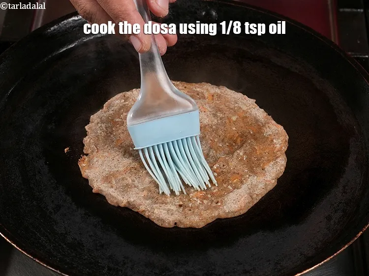 Step 13 – <p>Cook the dosa using 1/8 tsp oil.</p>
