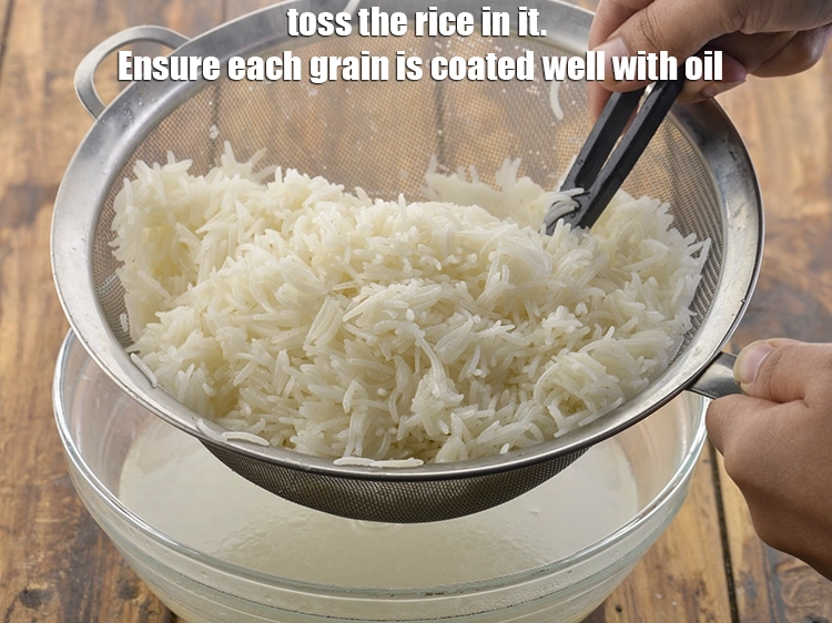 Step 12 – <p>Toss the rice in it. Ensure each grain is coated well with oil.</p>