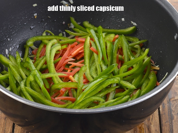 Step 23 – <p><span style="background-color:rgb(255,255,255);color:rgb(0,0,0);">Finally, add the 1/2 cup thinly </span><a href="https://www.tarladalal.com/glossary-capsicum-shimla-mirch-bell-pepper-163i#ing_2312"><u>sliced capsicum</u></a><span style="background-color:rgb(255,255,255);color:rgb(0,0,0);">. To make it more …