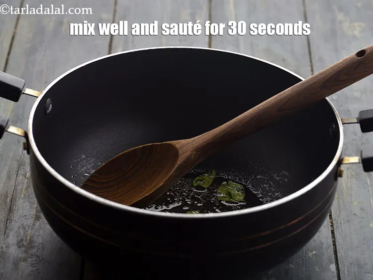 Step 14 – <p>Mix well and sauté on a medium flame for 30 seconds.</p>
