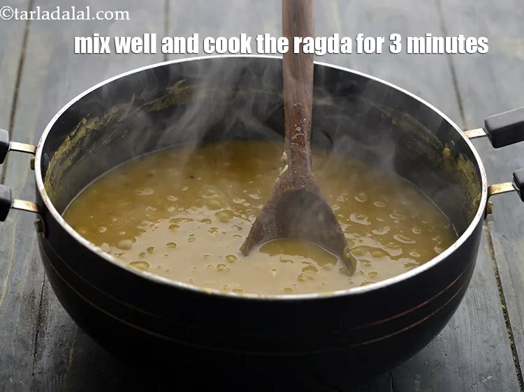 Step 22 – <p>Mix well and cook the <strong>ragda</strong> on a medium flame for 3 minutes, while stirring …