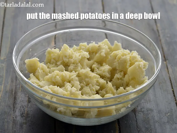 Step 24 – <p>To make the patties for <strong>Ragda Patties</strong>, put the mashed potatoes in a deep bowl.</p>