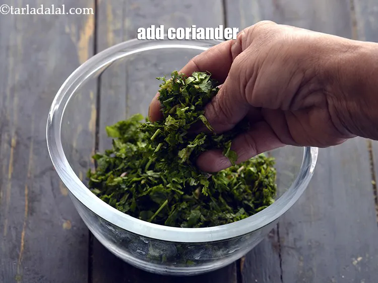 Step 30 – <p>Add the coriander. Make use of fresh leafy greens to get the best flavours.</p>
