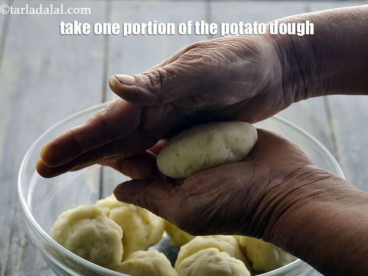Step 37 – <p>For making the stuffed patties, take one portion of the potato dough.</p>