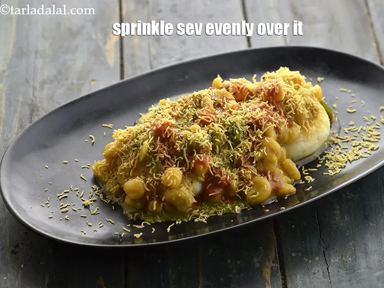 Step 51 – <p>Sprinkle 1 tbsp of sev evenly over it.</p>