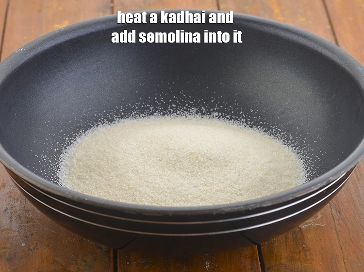 Step 2 – <p>Heat a kadhai and add the <span style="background-color:rgb(255,255,255);color:rgb(0,0,0);">1 cup </span><a href="https://www.tarladalal.com/glossary-semolina-sooji-rava-rawa-603i"><u>semolina (rava / sooji)</u></a> into …