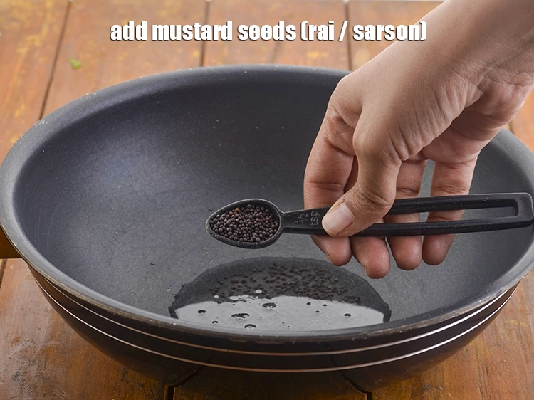 Step 6 – <p>Add the <span style="background-color:rgb(255,255,255);color:rgb(0,0,0);">1/2 tsp </span><a href="https://www.tarladalal.com/glossary-mustard-seeds-sarson-rai-sarson-ke-beej-525i"><u>mustard seeds ( rai / sarson)</u></a>. It is an …