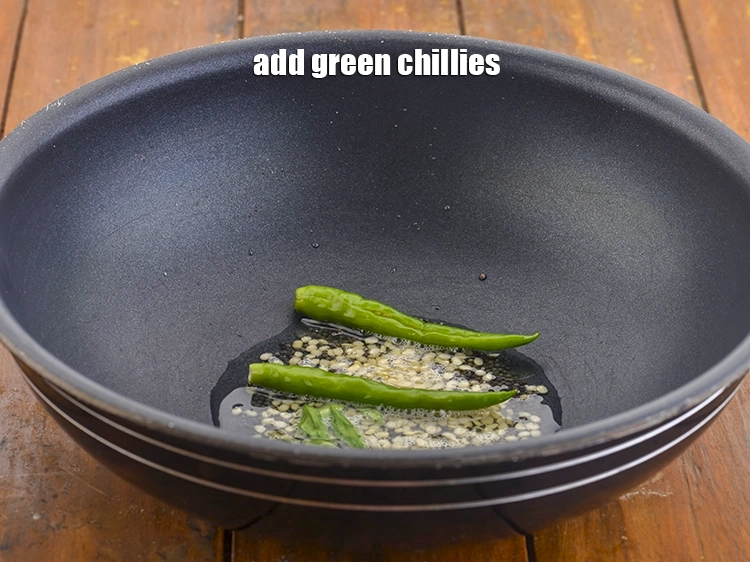 Step 9 – <p>Add the <span style="background-color:rgb(255,255,255);color:rgb(0,0,0);">2 </span><a href="https://www.tarladalal.com/glossary-slit-green-chillies-1856i"><u>slit green chilli</u></a> for the spice. You can also use …