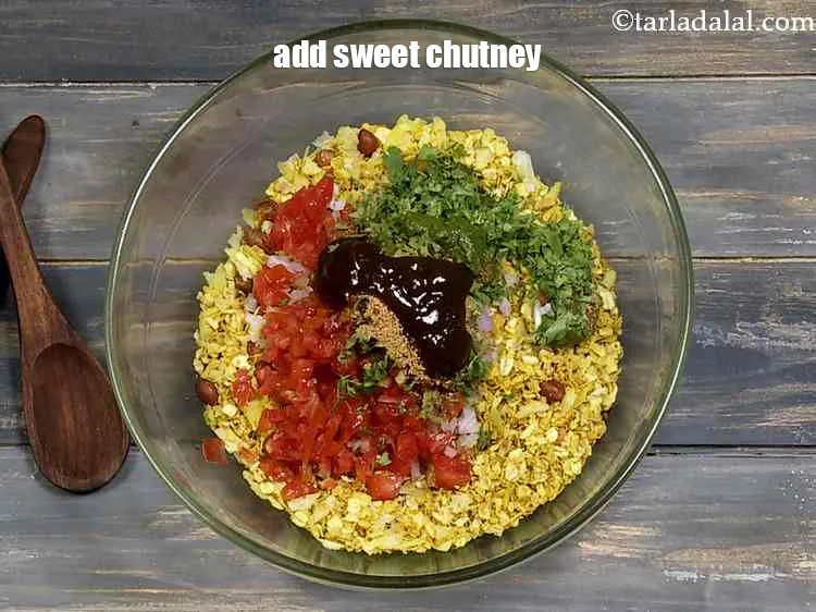 Step 15 – <p>Add the <span style="background-color:rgb(255,255,255);color:rgb(0,0,0);">1 tbsp </span><a href="https://www.tarladalal.com/glossary-sweet-chutney-2403i"><u>sweet chutney</u></a>.and <span style="background-color:rgb(255,255,255);color:rgb(0,0,0);">1 1/2 tbsp </span><a href="https://www.tarladalal.com/glossary-green-chutney-2401i"><u>green chutney</u></a><u>.</u></p>