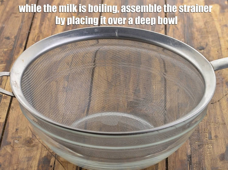 Step 4 – <p>While the milk is boiling, assemble the strainer by placing it over a deep bowl.</p>