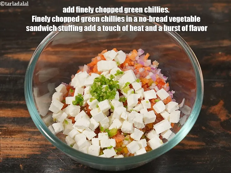 Step 14 – <p>Add 1 tsp finely <a href="https://www.tarladalal.com/glossary-chopped-green-chilli-820i">chopped green chillies</a>. Finely chopped green chillies in a no-bread …