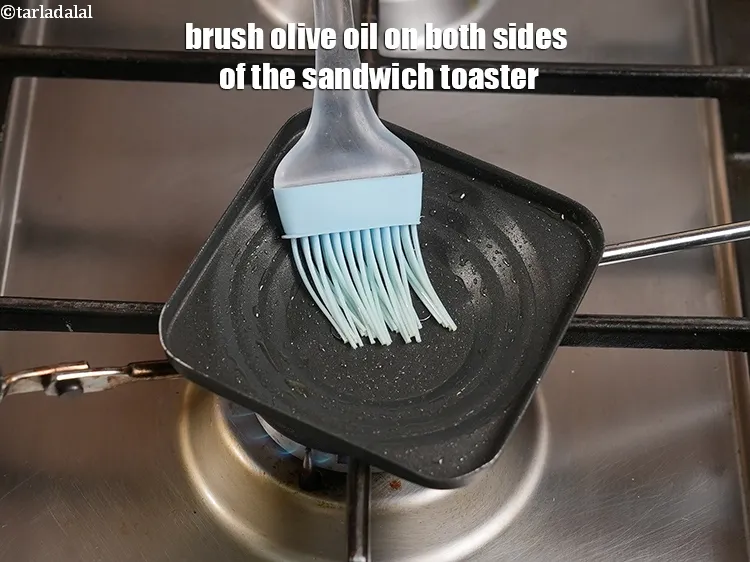 Step 17 – <p>Brush ¼ tsp olive oil on both sides of the sandwich toaster.</p>