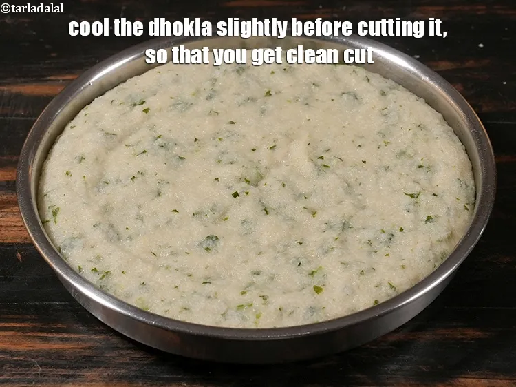 Step 28 – <p>Cool the dhokla slightly before cutting it, so that you get clean cut.</p>
