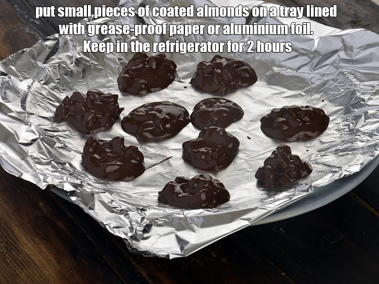 Step 5 – <p style="margin-left:0px;">Put small pieces of coated almonds on a tray lined with grease-proof paper or …