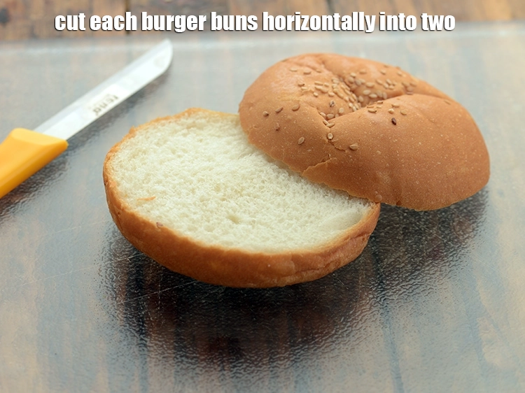 Step 8 – <p><span style="background-color:rgb(255,255,255);color:rgb(0,0,0);">Cut each </span><a href="https://www.tarladalal.com/glossary-burger-buns-1024i"><u>burger buns</u></a><span style="background-color:rgb(255,255,255);color:rgb(0,0,0);"> horizontally into two.</span></p>