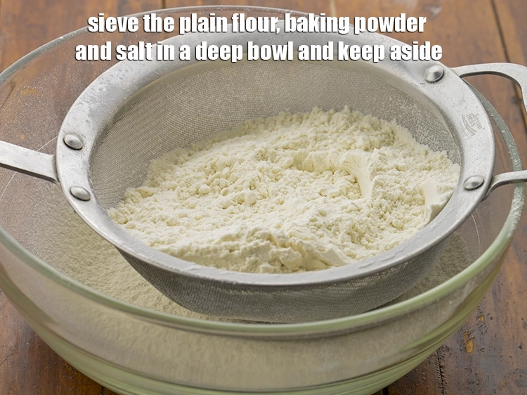 Step 1 – <p>Sieve the <a href="https://www.tarladalal.com/glossary-plain-flour-maida-188i"><u>plain flour (maida)</u></a>, <a href="https://www.tarladalal.com/glossary-baking-powder-425i"><u>baking powder</u></a> and <a href="https://www.tarladalal.com/glossary-salt-namak-table-salt-418i"><u>salt</u></a> in a deep …