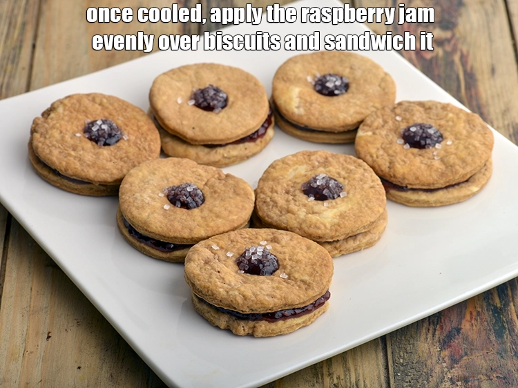 Step 12 – <p><span style="background-color:rgb(255,255,255);color:rgb(0,0,0);">Apply the </span><a href="https://www.tarladalal.com/glossary-raspberry-jam-241i"><u>raspberry jam</u></a><span style="background-color:rgb(255,255,255);color:rgb(0,0,0);"> evenly over biscuits and sandwich it.</span></p>