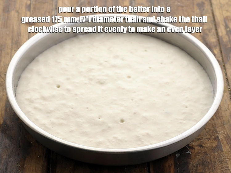 Step 6 – <p><span style="background-color:rgb(255,255,255);color:rgb(0,0,0);">Pour a portion of the batter into a greased 175 mm. (7”) diameter thali …