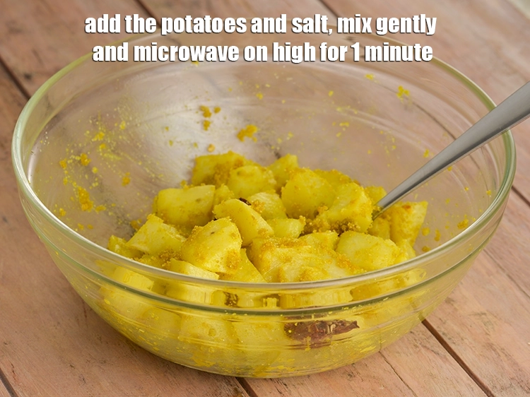 Step 5 – <p><span style="background-color:rgb(255,255,255);color:rgb(0,0,0);">Add the </span><a href="https://www.tarladalal.com/glossary-potatoes-aloo-alu-batata-710i#ing_2328"><u>potato cubes</u></a><span style="background-color:rgb(255,255,255);color:rgb(0,0,0);"> and </span><a href="https://www.tarladalal.com/glossary-salt-namak-table-salt-418i"><u>salt </u></a><span style="background-color:rgb(255,255,255);color:rgb(0,0,0);">to taste, mix gently …