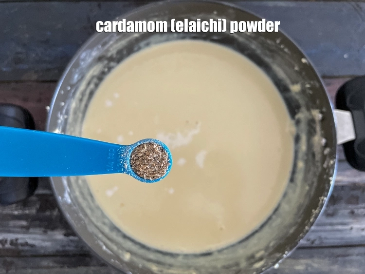 Step 10 – <p><span style="background-color:rgb(255,255,255);color:rgb(0,0,0);">Add </span><a href="https://www.tarladalal.com/glossary-cardamom-powder-elaichi-powder-265i"><u>cardamom (elaichi) powder</u></a><u>.</u></p>