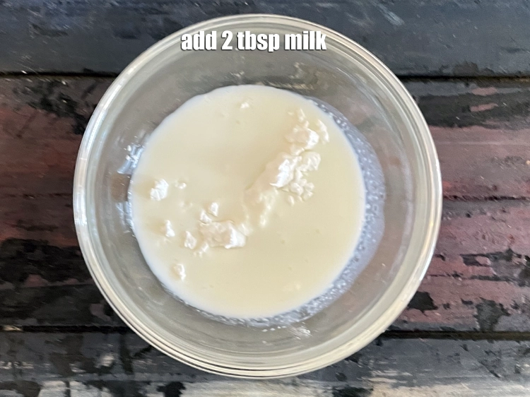 Step 2 – <p><span style="background-color:rgb(255,255,255);color:rgb(0,0,0);">Add&nbsp;2 tbsp&nbsp;</span><a href="https://www.tarladalal.com/glossary-milk-514i"><u>milk</u></a><u>.</u></p>