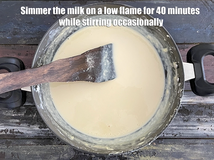 Step 8 – <p><span style="background-color:rgb(255,255,255);color:rgb(0,0,0);">Simmer the milk on a low flame for 40 minutes while stirring occasionally.</span></p>