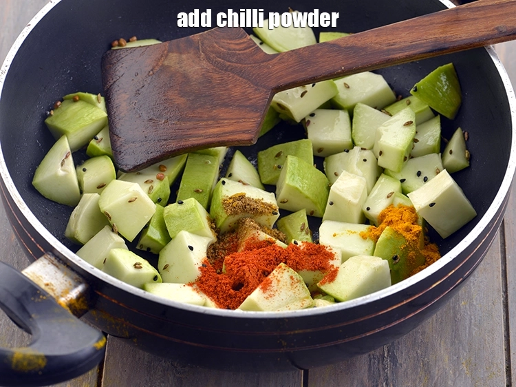 Step 11 – <p>Add <span style="background-color:rgb(255,255,255);color:rgb(0,0,0);">1 tsp </span><a href="https://www.tarladalal.com/glossary-chilli-powder-red-chilli-powder-339i"><u>chilli powder</u></a> to perk up the flavour of<strong> Amba Khatta.</strong></p>