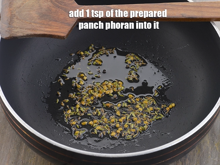 Step 7 – <p>Now add 1 tsp of the prepared <a href="https://www.tarladalal.com/glossary-panch-phoron-1027i"><u>panch phoron</u></a> into it. <strong>Panch Phoron</strong> is …