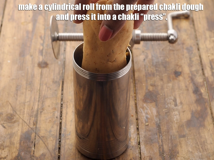 Step 11 – <p>Make a cylindrical roll from the prepared chakli dough and press it into a chakli …