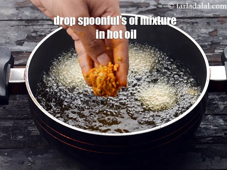 Step 14 – <p>Drop spoonful’s of the mixture into hot oil.</p>
