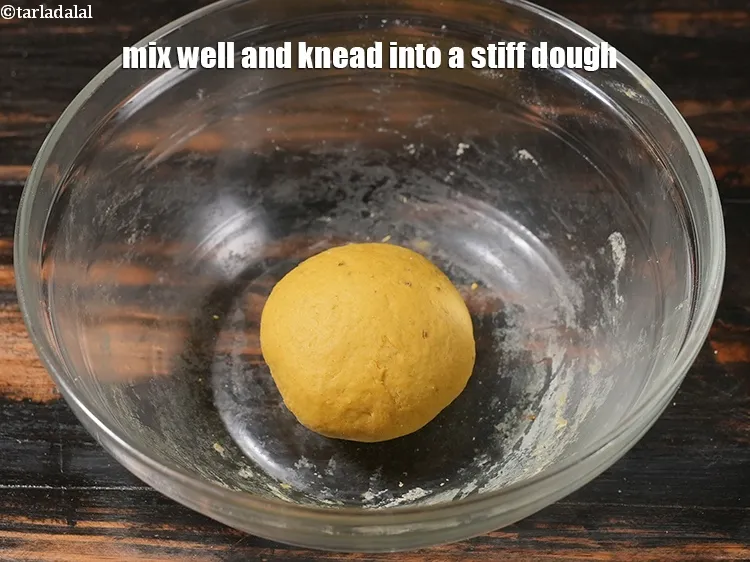 Step 12 – <p>Mix well and knead into a stiff dough.</p>