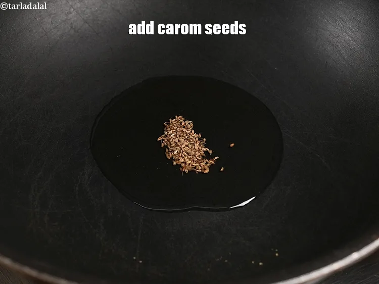 Step 18 – <p>Add 1/8 tsp <a href="https://www.tarladalal.com/glossary-carom-seeds-ajwain-thymol-seeds-bishops-weed-266i">carom seeds (ajwain)</a>.</p>