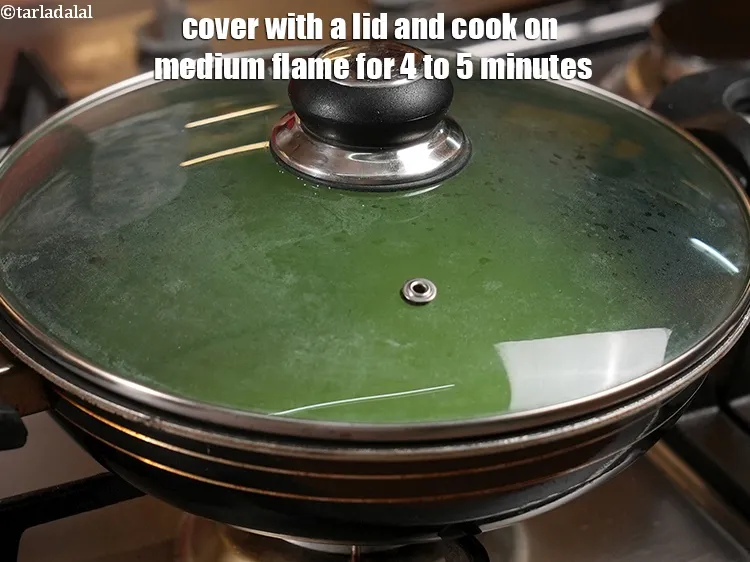 Step 25 – <p>Cover with a lid and cook on medium flame for 4 to 5 minutes.&nbsp;</p>