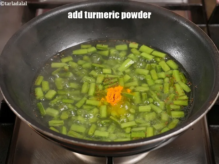 Step 29 – <p><span style="color:rgb(0,0,0);">Add ¼ tsp </span><a href="https://www.tarladalal.com/glossary-turmeric-powder-haldi-645i">turmeric powder (haldi)</a>.</p>