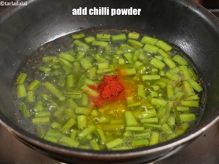 Step 30 – <p><span style="color:rgb(0,0,0);">Add ¼ tsp </span><a href="https://www.tarladalal.com/glossary-chilli-powder-red-chilli-powder-339i">chilli powder</a>.</p>