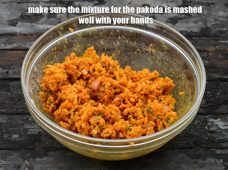 Step 20 – <p>Make sure the mixture for the pakoda is mashed well with your hands.&nbsp;</p>