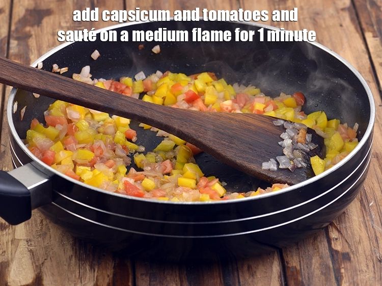 Step 7 – <p><span style="background-color:rgb(255,255,255);color:rgb(0,0,0);">Add the 1/2 cup </span><a href="https://www.tarladalal.com/glossary-yellow-capsicum-yellow-bell-pepper-yellow-shimla-mirch-171i#ing_2600"><u>chopped yellow capsicum</u></a><span style="background-color:rgb(255,255,255);color:rgb(0,0,0);"> and 1/4 cup </span><a href="https://www.tarladalal.com/glossary-tomatoes-tamatar-639i#ing_2361"><u>chopped …