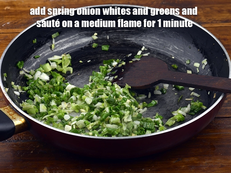 Step 2 – <p><span style="background-color:rgb(255,255,255);color:rgb(0,0,0);">Add the 1/2 cup </span><a href="https://www.tarladalal.com/glossary-spring-onion-hara-pyaz-443i#ing_2384"><u>chopped spring onions whites</u></a><span style="background-color:rgb(255,255,255);color:rgb(0,0,0);"> and </span><a href="http://tarladalal.com/glossary-spring-onion-greens-hare-pyaz-ke-patte-445i"><u>greens</u></a><span style="background-color:rgb(255,255,255);color:rgb(0,0,0);"> …