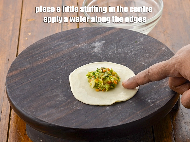 Step 8 – <p><span style="background-color:rgb(255,255,255);color:rgb(0,0,0);">Place a little stuffing in the centre apply a water along the edges.</span></p>