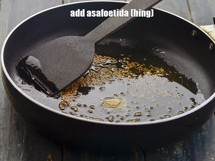 Step 22 – <p>When the seeds crackle, add the remaining ¼ tsp of <a href="https://www.tarladalal.com/glossary-asafoetida-hing-113i"><u>asafoetida (hing)</u></a>.</p>