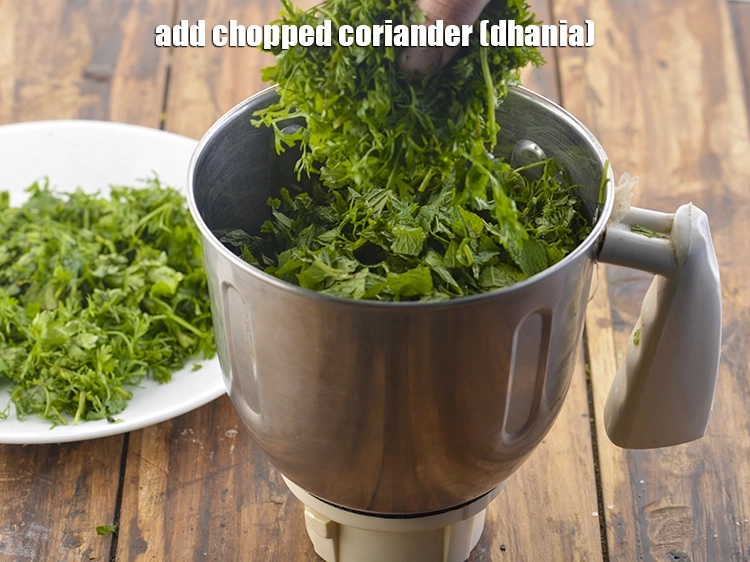 Step 11 – <p>Then add the <span style="background-color:rgb(255,255,255);color:rgb(0,0,0);">1 cup </span><a href="https://www.tarladalal.com/glossary-coriander-dhania-kothmir-369i#ing_2365"><u>chopped coriander (dhania)</u></a>.</p>